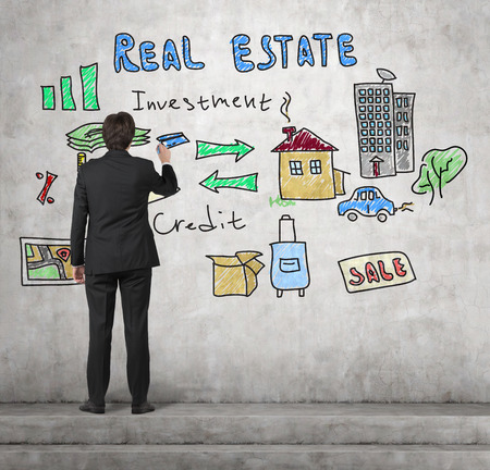 realtor drawing real estate concept on wallの写真素材