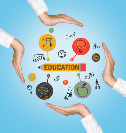 hands holding education icons on blue backgroundの写真素材