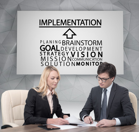 businesspeople working in office, implementation concept