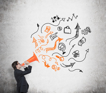 businessman holding road block with business iconsの写真素材