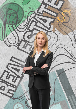 businesswoman with drawing real estate concept on wallの写真素材