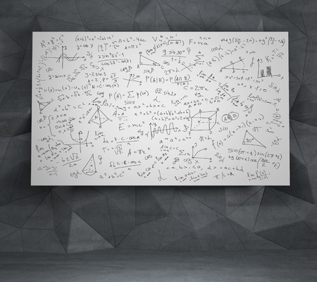 Mathematics equations and formulas on a white deskの写真素材