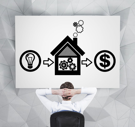 businessman looking to concept of real estate sales on deskの写真素材