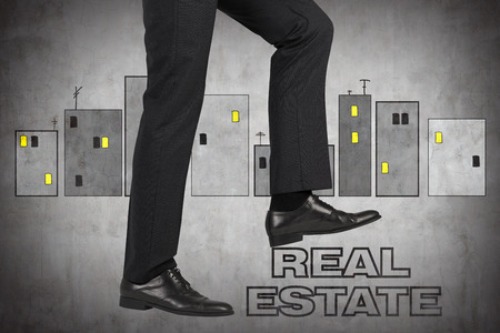 leg realtor comes on real estate symbolの写真素材
