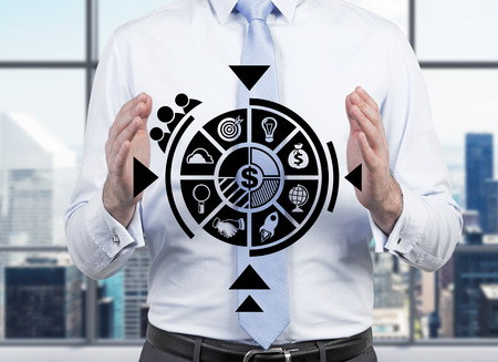 businessman holding business scheme in handの写真素材