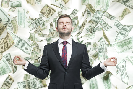 Meditative young businessman.の写真素材