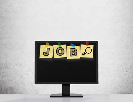 Yellow stickers are on the display with the word JOB as a symbol of the searching of the vacancies in the Internet. Concrete wall on the background.の写真素材