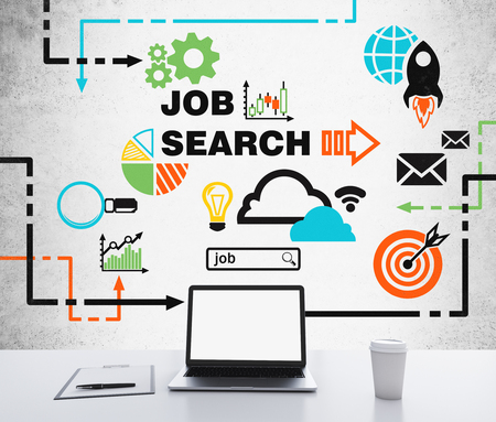 A laptop with white screen, a writing pad and a cup of coffee are on the white table. A colourful flowchart of recruitment process is drawn on the concrete wall. A job searching process. 3D rendering.の写真素材