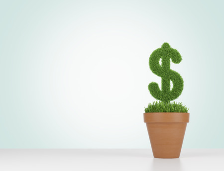 A flowerpot with grass green dollar sign on the table. Light green background.の写真素材