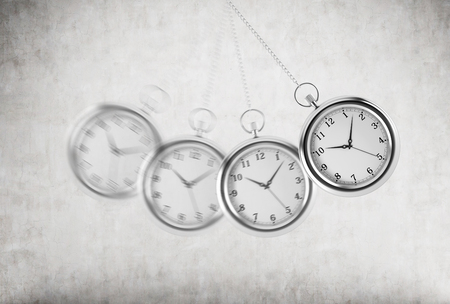 A pocket watch as a swing of the pendulum. Concrete background. 3D rendering. Time is money concept.の写真素材