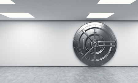 3D rendering of a big locked round metal safe in a bank depository,  a concept of security,  front view, right-centeredの写真素材