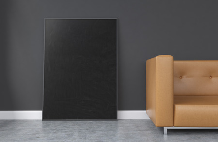 A big black frame leaning on the concrete wall, fragment of a brown sofa to the right. Concrete...