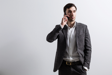 Man talking on phone, isolated on white background. Mock upの写真素材
