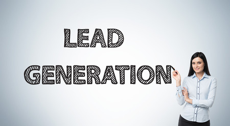 Lead generation concept with pointing businesswoman on grey background