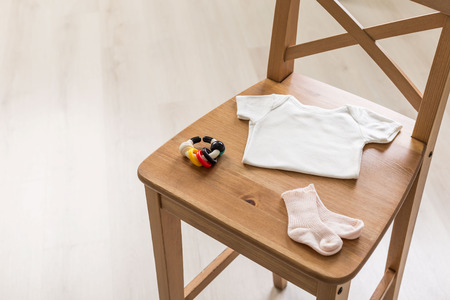 Wooden chair with baby goods