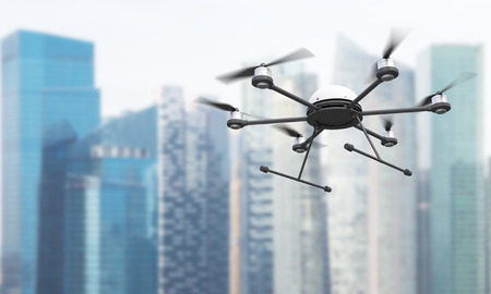 Quadrocopter on Singapore skyscrapers background. 3D Renderingの写真素材