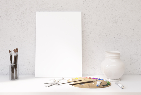 Front view of white desktop with blank canvas leaning on concrete wall, oil paint palette and tubes, decorative vase and set of brushes. Mock up, 3D Renderingの写真素材