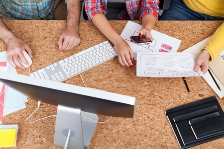 Colleagues working together at cork table. Concept of business development. Top viewの写真素材