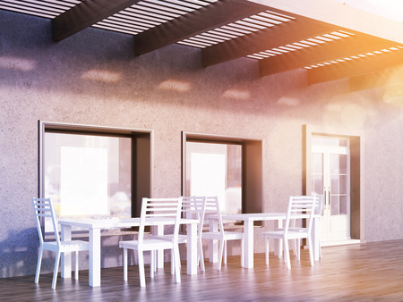 Cafe interior with two black posters in windows, white tables and chairs. Concept of successful business promotion. 3d rendering. Mock up. Toned imageの写真素材