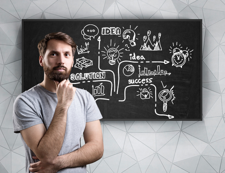 Pensive man in T-shirt presenting his idea of startup to prospective investors. Concept of selling...