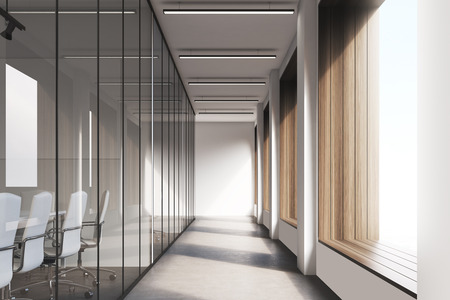 Front view of office interior with blank whiteboard behind glass doors, hallway with concrete floor and panoramic windows. Mock up, 3D renderingの写真素材