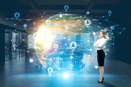 Side view of a buisnesswoman standing near a large network and Earth holograms in the air. Elements of this image furnished by NASA. Toned image. Double exposureの写真素材