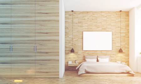 Front view of a bedroom with light wood walls, a double bed with gray bedding and a large horizontal poster hanging above it. 3d rendering, mock up, toned imageの写真素材