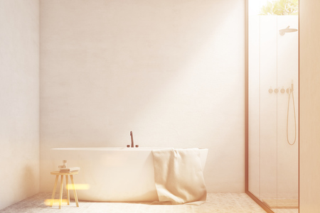 White bathroom interior with white walls, a tub standing near it and a shower with a glass wall. 3d rendering, mock up, toned imageの写真素材