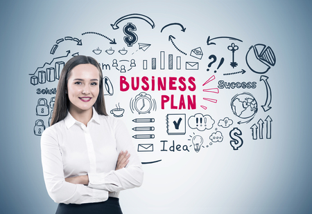 Crossed arms woman and business plan grayの写真素材