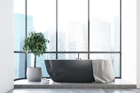 Panoramic bathroom interior with a black tub, a tree in a pot and a concrete floor. 3d rendering mock upの写真素材