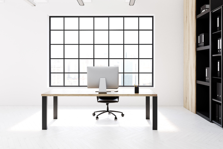 Minimalistic CEO office interior with a simple wooden table with black legs, a bookcase near a right wall and a large window. 3d rendering mock upの写真素材