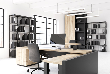 CEO office interior with an original table, a computer standing on it, a bookcase with black binders and loft windows. Close up. 3d rendering mock upの写真素材