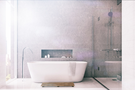 Gray bathroom interior with white tiles used as a decoration element. There is a white tub, a shower with a glass door and a large window. 3d rendering mock up toned imageの写真素材