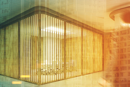 Glass and blinds meeting room in a wooden office lobby with a businessman in the foreground. 3d rendering mock up toned image double exposureの写真素材