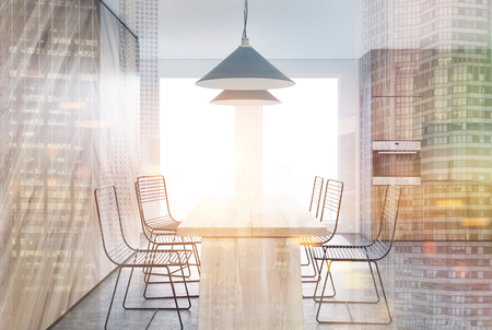 Wooden dining room interior with a long wooden table, two rows of metal chairs and a kitchen in the background. 3d rendering mock up toned image double exposureの写真素材