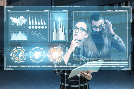 Close up of a young woman in glasses talking to her boss and analyzing graphs in virtual reality. Toned image double exposure mock up Elements of this image furnished by NASAの写真素材