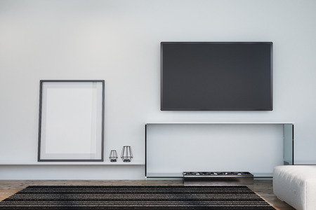 White living room interior with a wooden floor a framed poster, a decorative fireplace and a plasma TV on a wall. 3d rendering mock upの写真素材