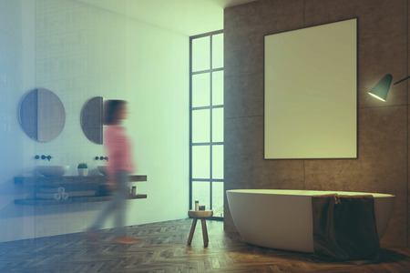 Concrete bathroom interior with a loft window and a white tub with a poster hanging above it. A double sink with round mirrors. A woman, side view. 3d rendering mock up toned image double exposureの写真素材