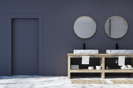 Black bathroom interior with a white marble floor, a double sink with two round mirrors above it and a closed door. 3d rendering mock upの写真素材
