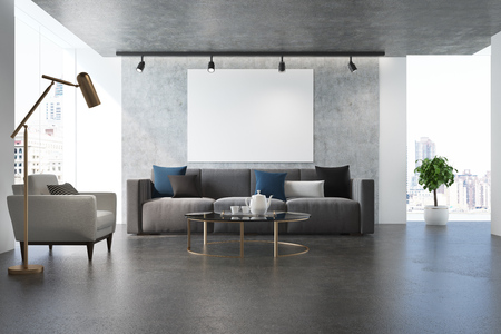 Concrete living room with a poster, a concrete floor, a large window and a long gray sofa near a white armchair. 3d rendering mock upの写真素材