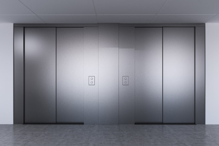 Elevator hall in a modern office, hospital or a hotel. Gray wide elevator doors. Concept of modern...