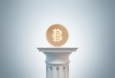 Gold bitcoin standing on a white column against a gray background . Concept of mining. 3d rendering toned image double exposureの写真素材