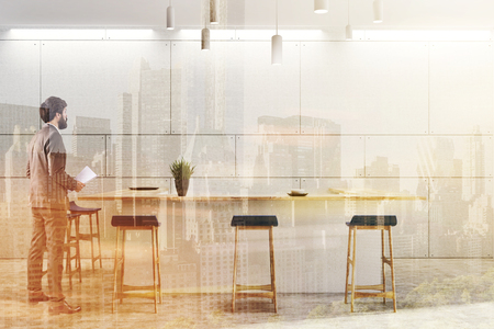 White wall eco bar interior with white tables and blue stools. A potted plant on a bar. A man 3d rendering toned image double exposureの写真素材