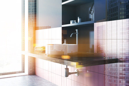 Round sink in a pink tiled and black bathroom interior with wide toiletry shelves behind it. A side view. 3d rendering mock up toned image double exposureの写真素材