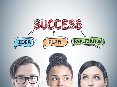 Portraits of diverse business team members against a gray wall with a success, idea, plan, realization sketch. Concept of brainstormingの写真素材