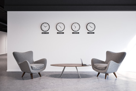 White wall office waiting room with a number of clocks and gray armchairs near the coffee table. 3d rendering mock upの写真素材