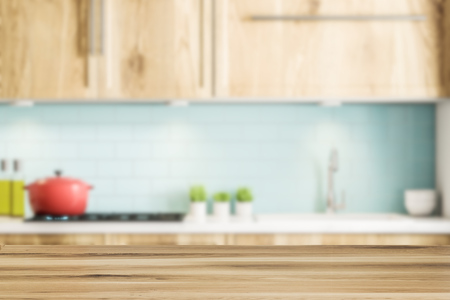 Blue tile kitchen interior with wooden countertops and cabinets, a red cooking pot and several potted plants. 3d rendering mock up blurredの写真素材
