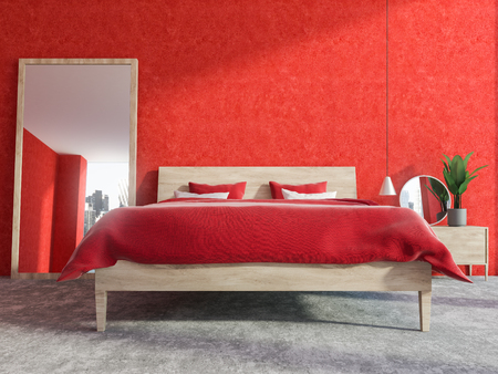 Luxury bedroom interior with a concrete floor, red walls, a red double bed and a makeup table. A large vertical mirror on the floor. 3d rendering mock upの写真素材