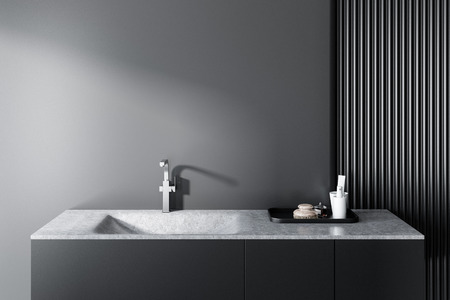 Gray bathroom interior with a stylish gray sink. Soap and bottles on the shelf. 3d rendering mock upの写真素材