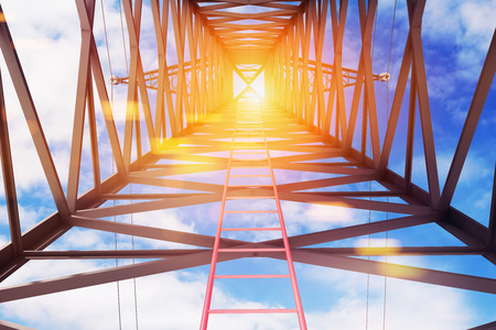Red ladder inside a huge power line support as seen from the ground. Blue sky with clouds. and sun Concept of growth in business and life. 3d rendering mock upの写真素材